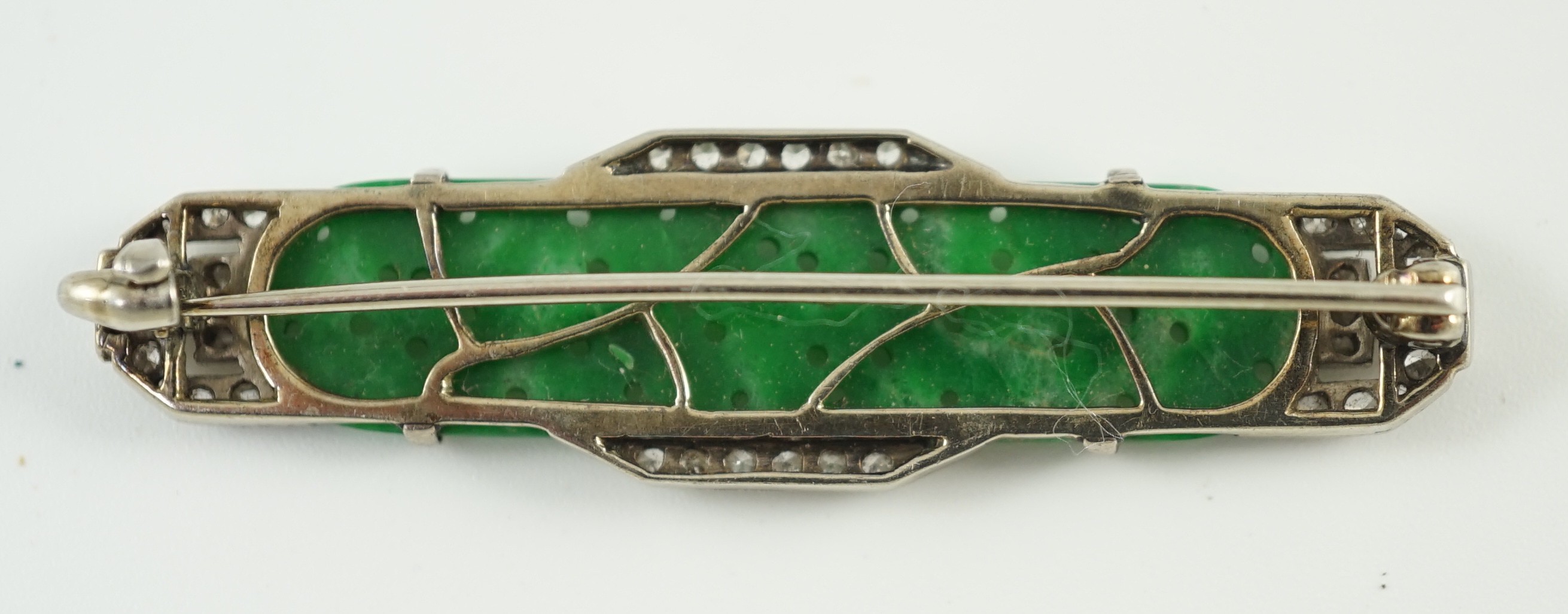 An Art Deco white gold, jadeite and diamond set bar brooch